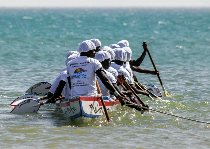 people riding on boat during daytime